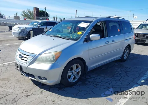 2010 Honda Odyssey Touring z USA, uszkodzony, nr VIN 5FNRL3H99AB033083